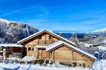 Discover the charm of this stunning wooden chalet nestled in a picturesque winter wonderland.