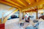 Discover the charm of this stunning property, featuring a warm and inviting interior with exposed wooden beams and a cozy ambiance.