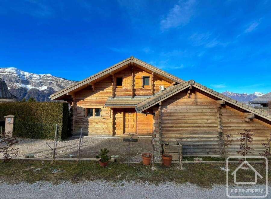 Discover the charm of this stunning wooden chalet nestled in a picturesque mountain setting.