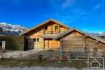 Discover the charm of this stunning wooden chalet nestled in a picturesque mountain setting.