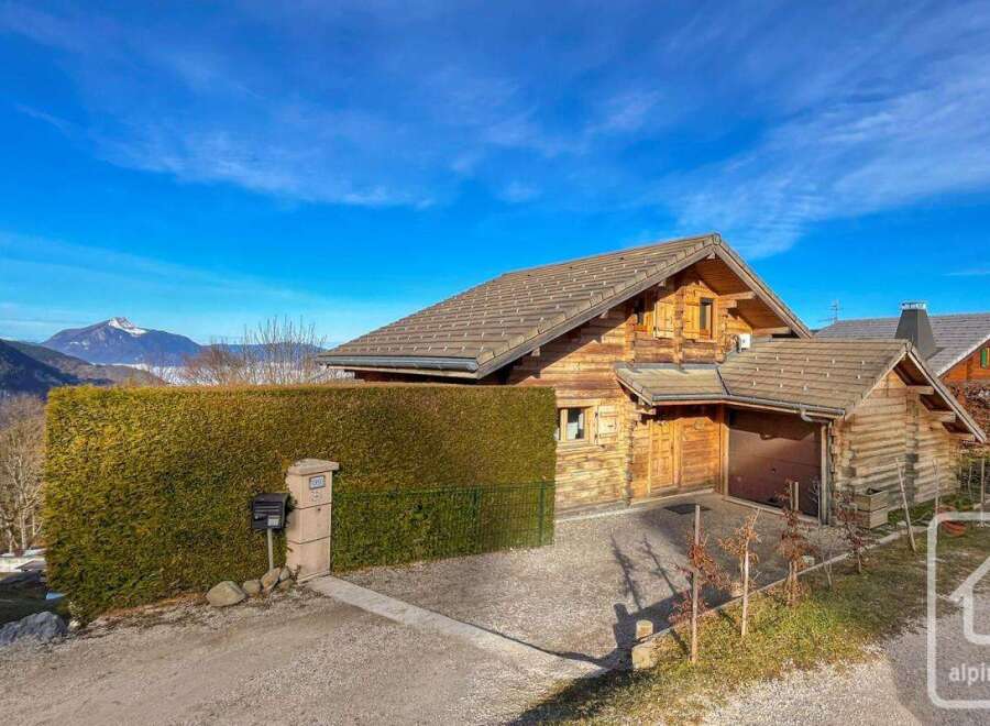 Discover the charm of this stunning wooden chalet nestled in a picturesque mountain setting.