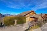 Discover the charm of this stunning wooden chalet nestled in a picturesque mountain setting.
