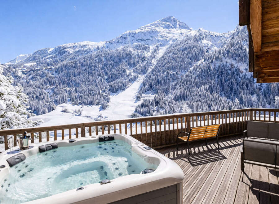Enjoy breathtaking mountain views from this luxurious property featuring a private hot tub.