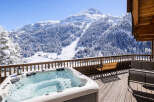 Enjoy breathtaking mountain views from this luxurious property featuring a private hot tub.