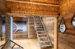 Step into luxury with this stunning property featuring exquisite wooden accents and a unique design.