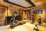 This stunning home gym offers a luxurious space for your fitness routine.