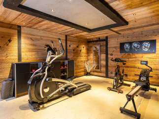 This stunning home gym offers a luxurious space for your fitness routine.