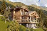 Experience the epitome of mountain living in this stunning wooden chalet.
