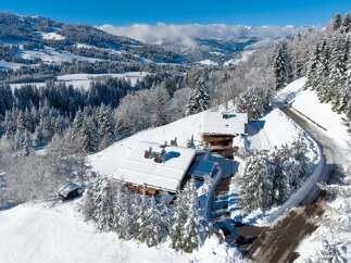 Nestled in a winter wonderland, this charming property offers a serene escape.