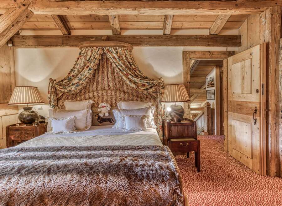 Step into a cozy bedroom retreat, where rustic charm meets elegant design.