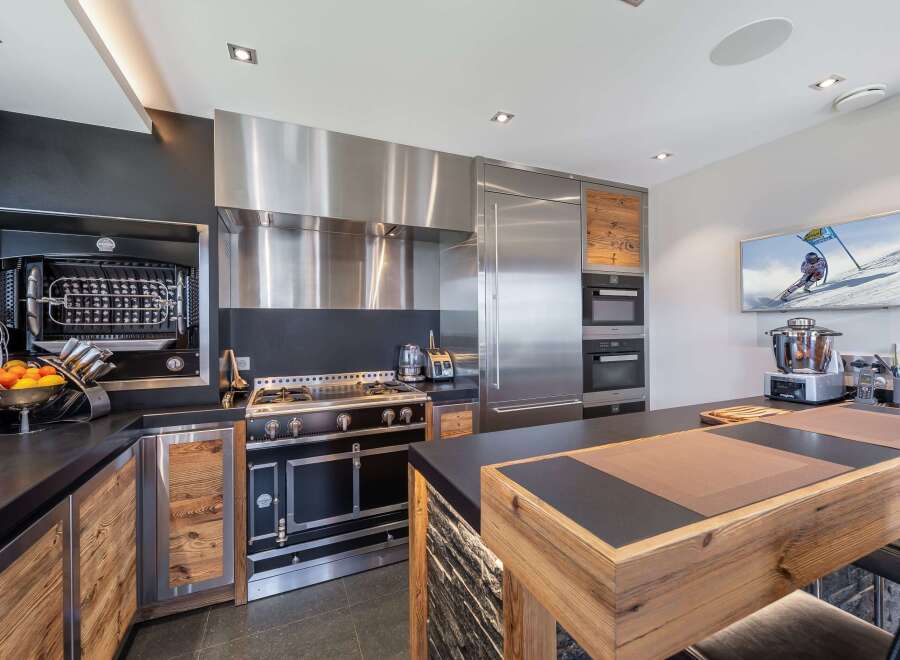 Experience culinary excellence in this stunning kitchen! Featuring top-of-the-line appliances, including a professional-grade range and oven, this space is designed for both functionality and style.