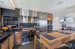 Experience culinary excellence in this stunning kitchen! Featuring top-of-the-line appliances, including a professional-grade range and oven, this space is designed for both functionality and style.