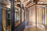 Step into luxury with this stunning walk-in closet, featuring custom cabinetry and ample storage space.
