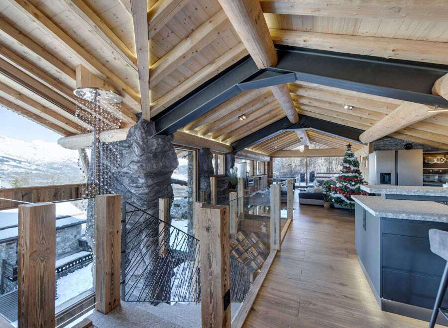 Experience luxury living in this stunning chalet, featuring a unique blend of rustic charm and modern design.