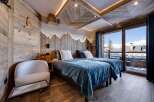 Experience the ultimate in alpine luxury with this stunning bedroom.