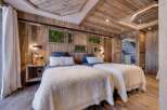 Experience rustic luxury in this stunning bedroom.