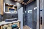 Experience luxury in this stunning bathroom, featuring a sleek, modern design.