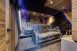 Step into luxury with this stunning home theater! Featuring plush seating, a starry night ceiling, and acoustic paneling, this space is designed for ultimate comfort and immersive entertainment.