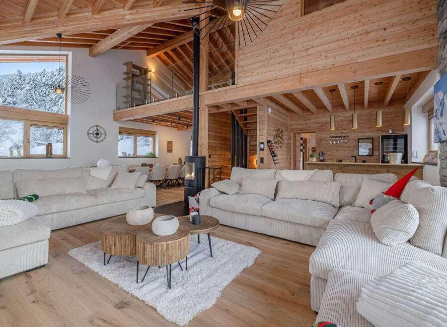 Experience the epitome of luxury living in this stunning chalet, boasting a warm and inviting interior.