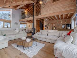 Experience the epitome of luxury living in this stunning chalet, boasting a warm and inviting interior.