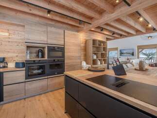 This stunning kitchen boasts a modern design with a rustic touch, perfect for any home.