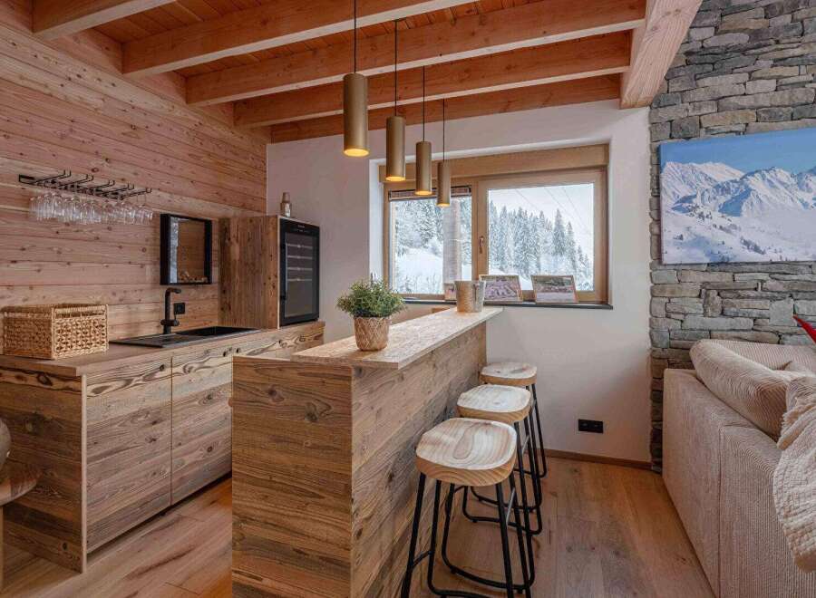 Experience rustic elegance in this stunning property, featuring a beautifully designed bar area perfect for entertaining.