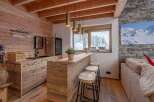 Experience rustic elegance in this stunning property, featuring a beautifully designed bar area perfect for entertaining.