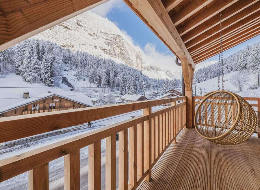 Experience the ultimate winter escape in this stunning property! Enjoy breathtaking views of snow-capped mountains and a charming village from your private balcony.