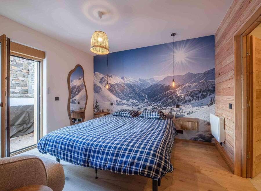 Experience the ultimate mountain retreat in this stunning bedroom.