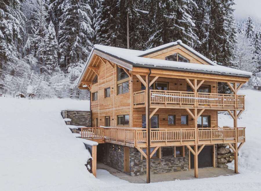 This stunning wooden chalet offers a perfect blend of rustic charm and modern comfort.