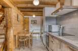 Step into this charming property featuring a cozy kitchen with modern appliances and a dining area perfect for gatherings.