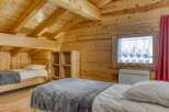 Discover the charm of this cozy cabin retreat, featuring warm wooden interiors and a welcoming atmosphere.