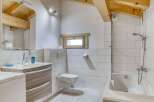 This charming bathroom features a modern design with a touch of rustic elegance.