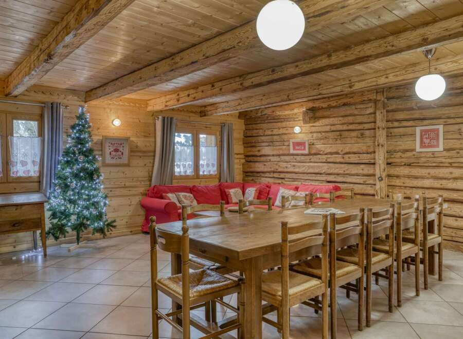 Step into this inviting chalet, featuring a spacious dining area perfect for gatherings.