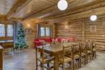 Step into this inviting chalet, featuring a spacious dining area perfect for gatherings.