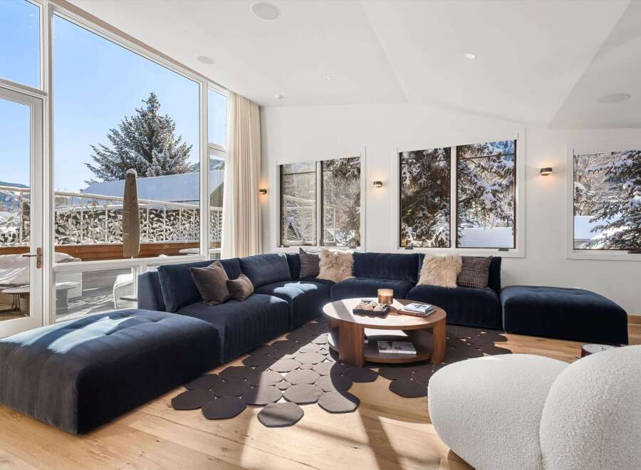 Experience luxury living in this stunning property, featuring a spacious and inviting living room.