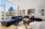 Experience luxury living in this stunning property, featuring a spacious and inviting living room.