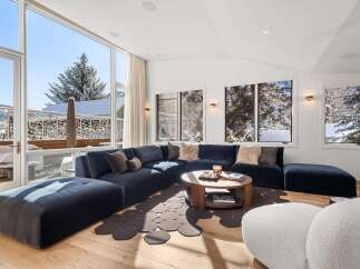 Experience luxury living in this stunning property, featuring a spacious and inviting living room.