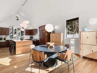 This stunning dining area boasts a modern design with a touch of natural elegance.