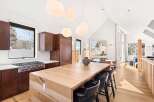 This stunning kitchen boasts a modern design with a spacious island, perfect for entertaining.