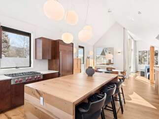 This stunning kitchen boasts a modern design with a spacious island, perfect for entertaining.