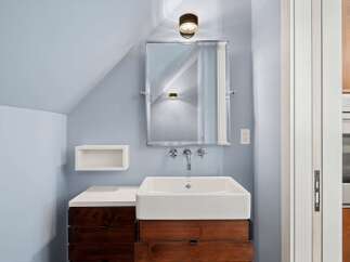 This modern bathroom features a sleek design with a minimalist aesthetic.
