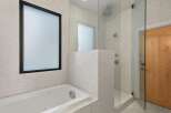 Step into a luxurious bathroom retreat, featuring a sleek, modern design.
