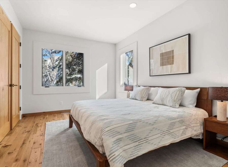 This stunning bedroom features a modern design with a cozy atmosphere.