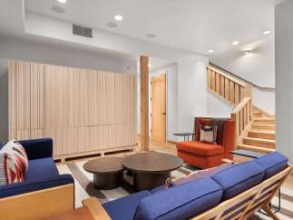 This stunning living space boasts a modern design with a touch of rustic charm.