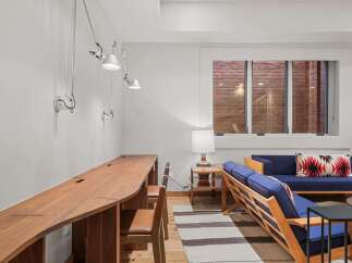 This stunning property boasts a modern and inviting interior, perfect for both work and relaxation.
