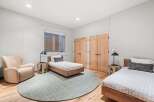 This inviting bedroom features two twin beds with stylish bedding, perfect for guests or family.