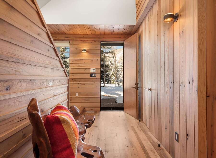 Step into a world of rustic elegance with this stunning entryway.
