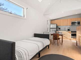 This cozy studio apartment offers a perfect blend of comfort and convenience.