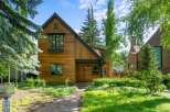 This stunning property boasts a beautiful wooden exterior, exuding warmth and charm.
